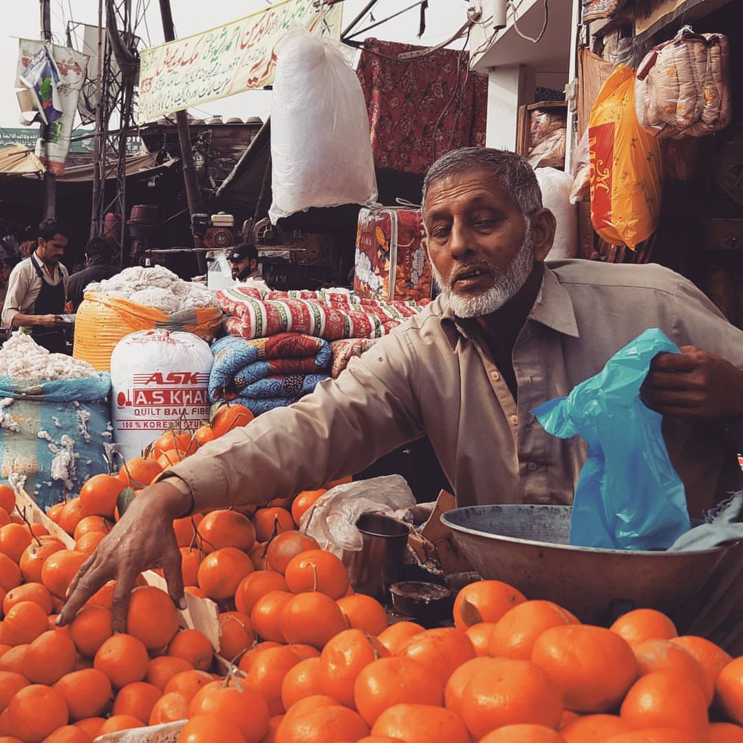 A fruit seller at a bazaar in Pakistan